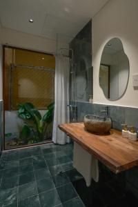 a bathroom with a sink and a mirror at Amea Homestay in Thôn Kim Long (1)