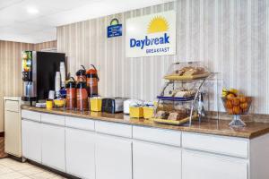 a kitchen with a counter with food on it at Days Inn by Wyndham Scranton PA in Dickson City