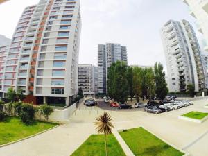 a view of a parking lot with two tall buildings at Canas Guest House in Lisbon (AL) in Lisbon