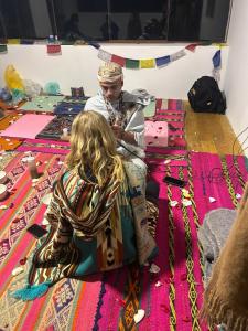 a man and a girl sitting on the floor at Maska Mystic Tribe - Community Life in Pisac +71 photos