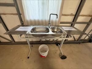 a stainless steel sink in a room with a window at Karma on Compass in Edithburgh +12 photos