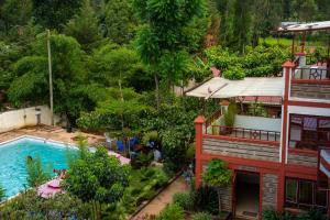 an overhead view of a resort with a swimming pool at Kusi Hotel Kakamega in Kakamega