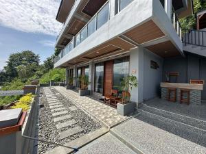 a house with a patio with plants on it at Toba Crest Vue in Parapat