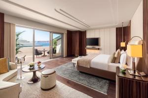 a hotel room with a bed and a living room at Mandarin Oriental Bosphorus, Istanbul in Istanbul