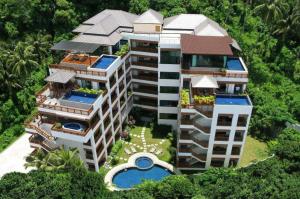 an aerial view of a building with a swimming pool at Surin Sabai Residence near Surin Beach in Surin Beach