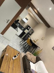 a living room with a couch and a table at Appartement Bellegarde in Bellegarde +1 photo