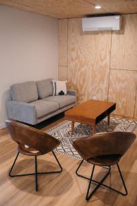 a living room with a couch and a table at Outbounder in Bayfield