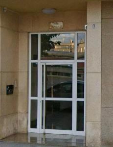 a large white door on a building at Llano Urban Park in Murcia