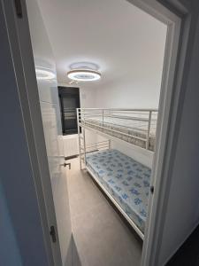 a hallway with a bunk bed in a room at Llano Urban Park in Murcia