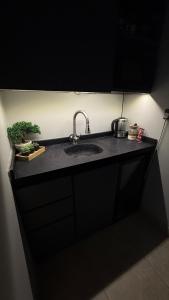 a kitchen counter with a sink in a room at Cozy privet unit شقة وحيدة وهادئة in Riyadh +21 photos