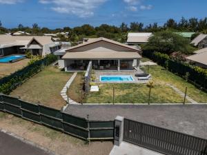 an aerial view of a house with a swimming pool at Salty Sands Studio in Rivière Noire