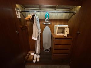 a small bathroom with a toilet and a sink at Jubilee Prestige Hotel Ratchadapisek in Bangkok
