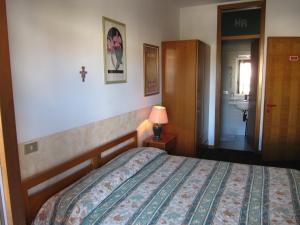 Postel nebo postele na pokoji v ubytování Hotel Rizzi