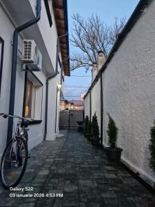a bike parked on the side of a building at Casa Rahova - centru civic in Brăila