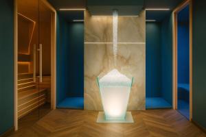 a room with a glass vase hanging from the ceiling at Boutique Hotel Bogliaco in Gargnano +36 photos