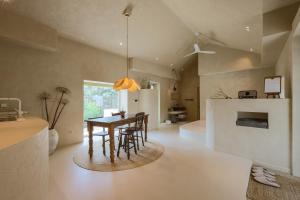 a dining room with a table and some chairs at 스테이스스와 야외자쿠지무료 in Sogil-li +32 photos