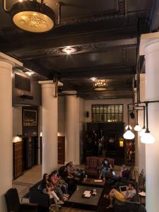 a group of people sitting in a living room at Ace Hotel New York in New York