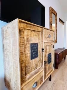 a wooden dresser with a sign on it at Apartment Gastein 3 in Bad Gastein
