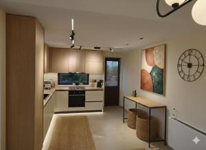 a kitchen with a table and a counter top at Agnanti Houses in Mythimna