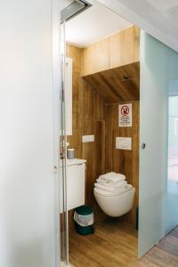 a bathroom with a toilet and a glass door at Godello - Harbor's Light in Villajoyosa +7 photos