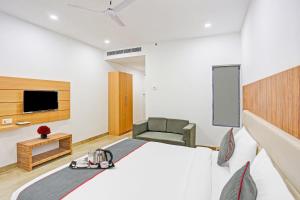 a hotel room with a bed and a tv at Townhouse Super Two Premium in Varanasi