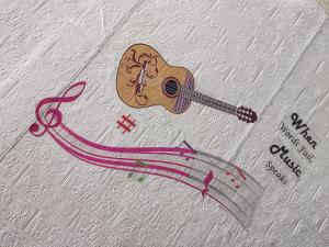 a drawing of a guitar on a sheet of paper at Blue Sapphire in Hinjewadi