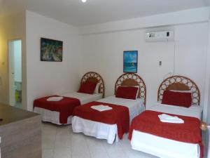 Ένα ή περισσότερα κρεβάτια σε δωμάτιο στο Sunset Hotel