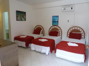 Ένα ή περισσότερα κρεβάτια σε δωμάτιο στο Sunset Hotel