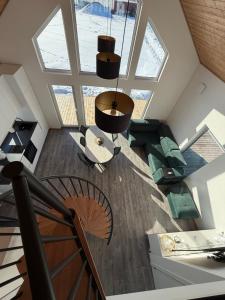 an overhead view of a living room with a ceiling at REAL House in Vītoliņi +22 photos