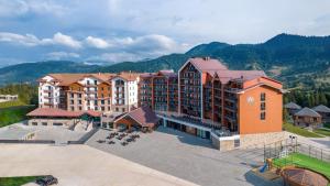 an aerial view of a resort with mountains in the background at Ambassadori Goderdzi Hotel in Goderdzi