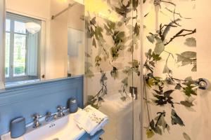 a bathroom with a shower with a toilet and a sink at Lo Studiolo Fiesole in Fiesole
