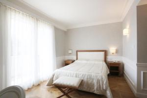 Letto o letti in una camera di Tesoretto Hotel