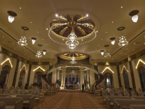 a large room with chairs and a chandelier at Ummaid palace, Siwan in Siwān