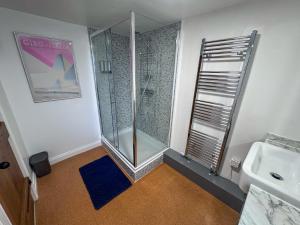 a bathroom with a shower and a sink at Arcadia Cottage, Mere in Mere +19 photos