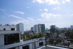 a view of the city from the balcony of a building at Abat property Rental in Addis Ababa