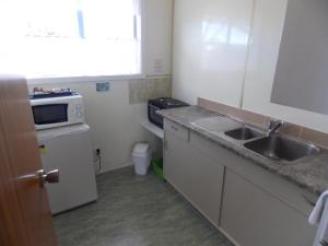 Kuchyň nebo kuchyňský kout v ubytování Rangiora Lodge Motel