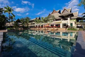 a swimming pool in front of a resort at La Solaya Khao Lak in Khao Lak