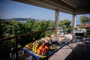 a table with fruits and vegetables on a balcony at Antica Dimora Palinuro in Palinuro