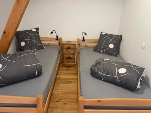 two bunk beds in a small room with at Le Matagot Auberge-Restaurant in Mazeyrat-Aurouze