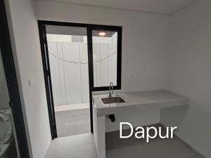 a bathroom with a sink and a mirror at Park Serpong Type XYZ Cluster Charm in Carangpulang