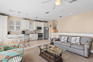 a living room with a couch and a table at Destiny Beach Villas #9A in Destin