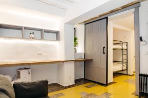 a room with a door leading to a bedroom at Lambrusco - Harbor's Light in Villajoyosa