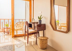 a desk with a chair and a mirror in a room at Ananas Beach Resort in Agonda +33 photos