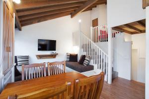 a living room with a table and a couch at Gundy Lodge in Dinner Plain