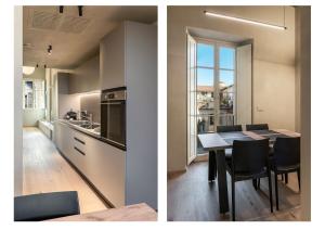 a kitchen and a dining room with a table at Dimora Beggiami by Vayadù in Savigliano