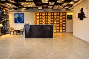 a room with a large screen in the middle of a floor at Dragonfly Hotel - The Art Hotel in Mumbai