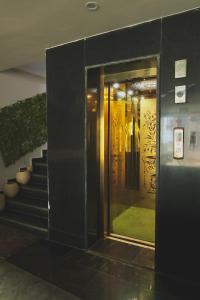 a building with a staircase and a door with a window at Sufi stay in Rishīkesh