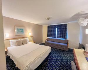 a hotel room with a bed and a window at Travel Plaza Hotel in Desborough +56 photos