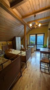 a large room with two beds and a wooden ceiling at Agroturystyka SPA in Zelków +67 photos