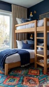 a bedroom with two bunk beds and a rug at MOLELEKI in in Mthatha